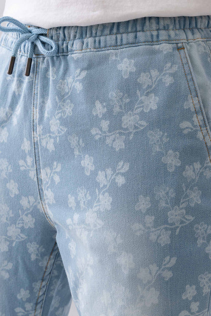 Close-up of the elastic drawstring waistband on Fashnica women's floral print stretch denim jeans.